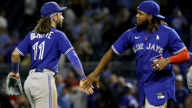 Bo Bichette and Vladimir Guerrero Jr. celebrate